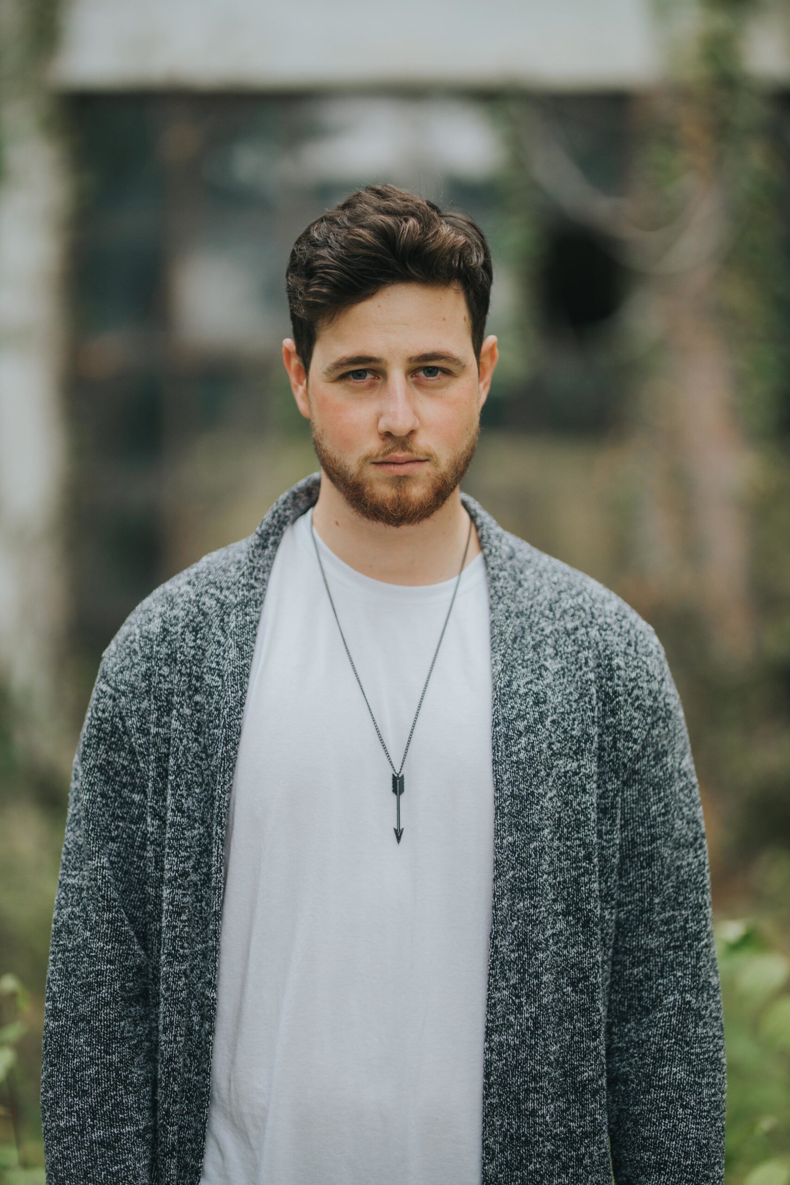 shallow focus shot of a young and attractive male posing at camera